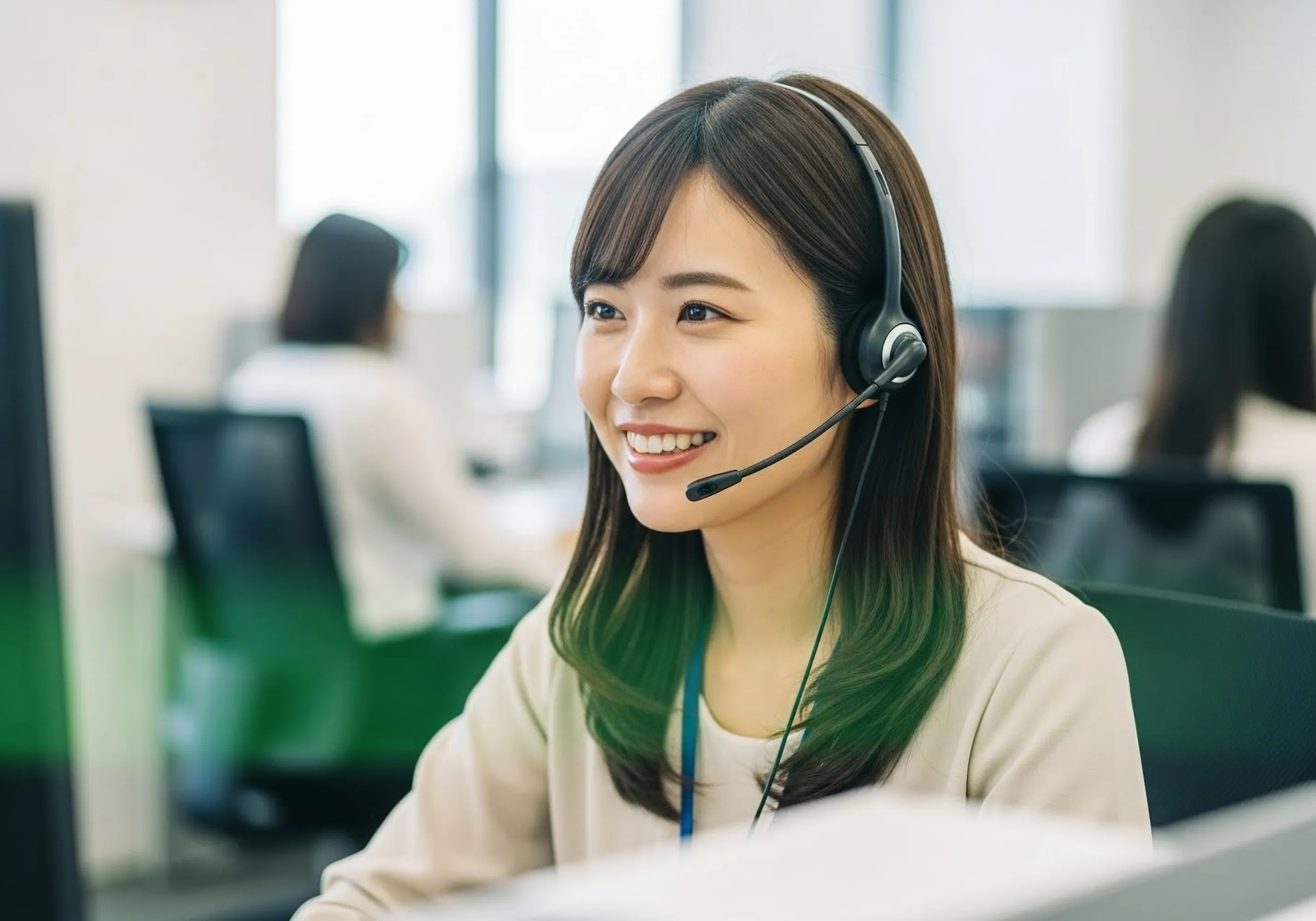 woman wearing a headset working and smiling 
