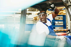 man operating forklift