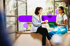 two colleagues talking in the office