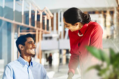 two people talking to each other about work