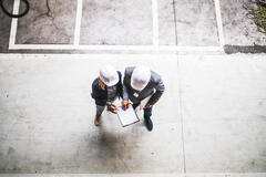 top view of two engineers with clipboard