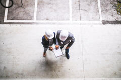 top view of two engineers with clipboard