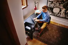 a person giving intervew on skype