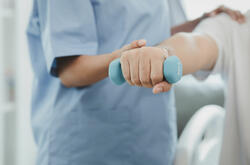 A nurse helping a patient