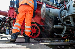 Railway worker in action at railway station
