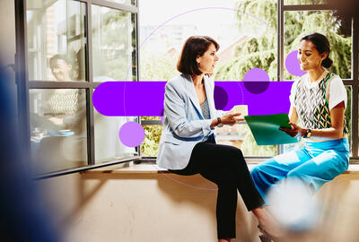 two colleagues talking in the office