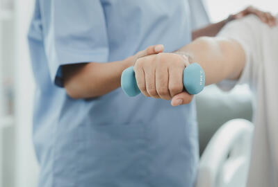 A nurse helping a patient