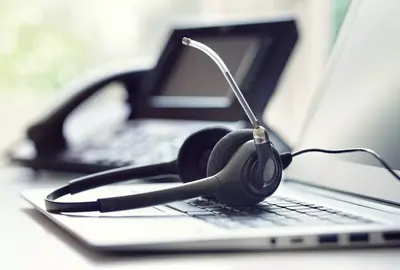 VOIP headset headphones telephone and laptop concept for communication, it support, call center and customer service help desk