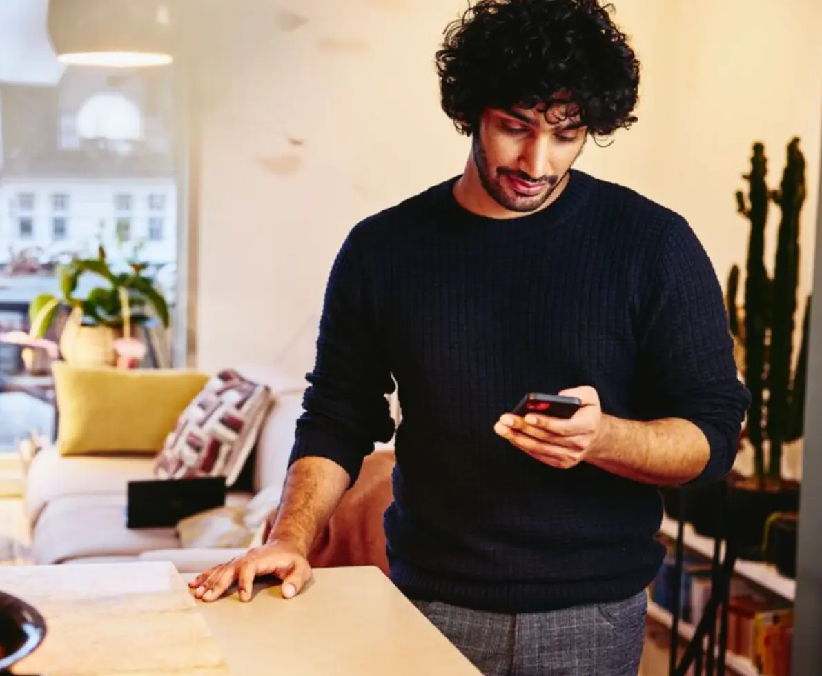 man looking at phone