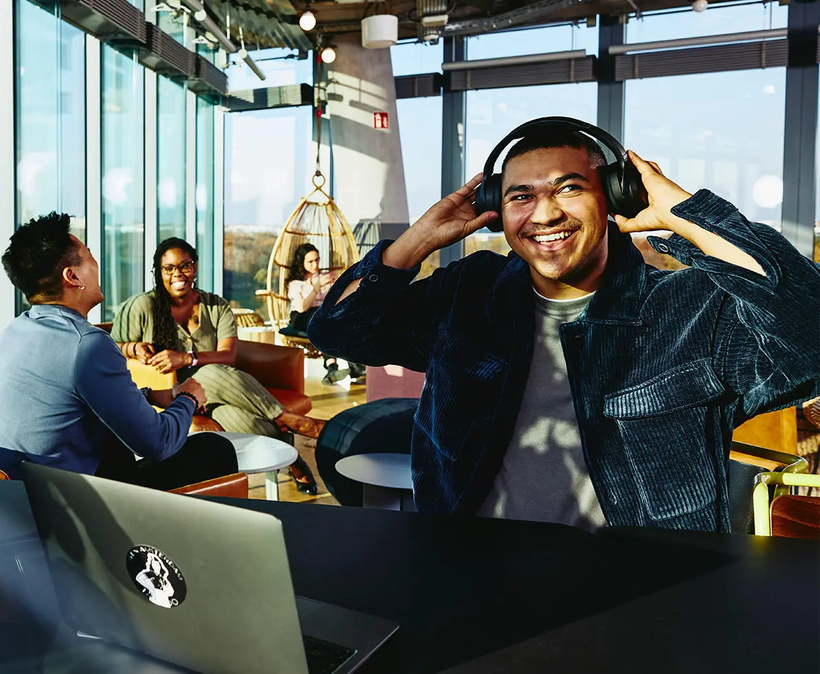 man smiling at his desk