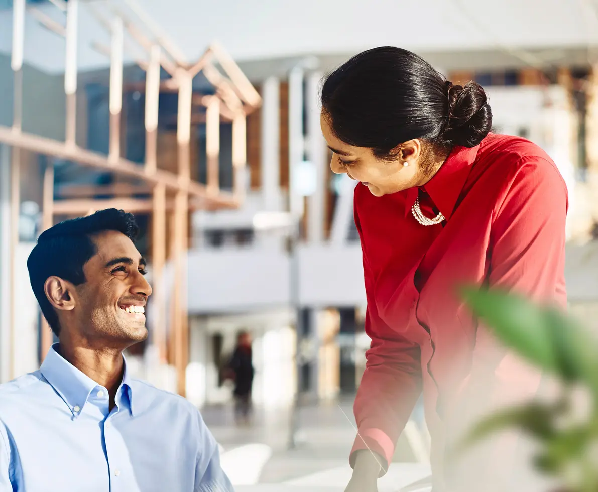 two people talking to each other about work