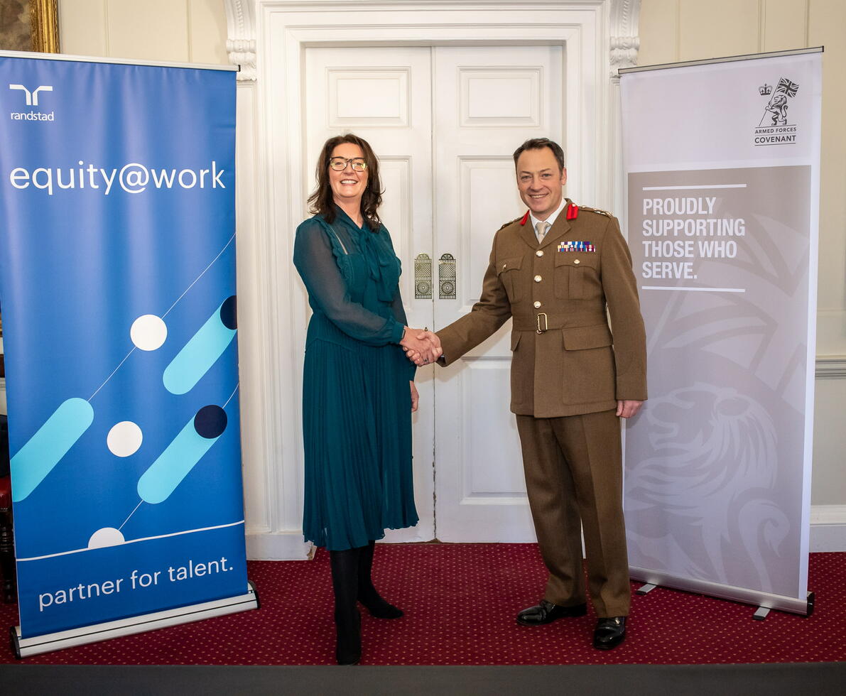 Victoria Short, Randstad CEO shaking hands with a member of the AFC
