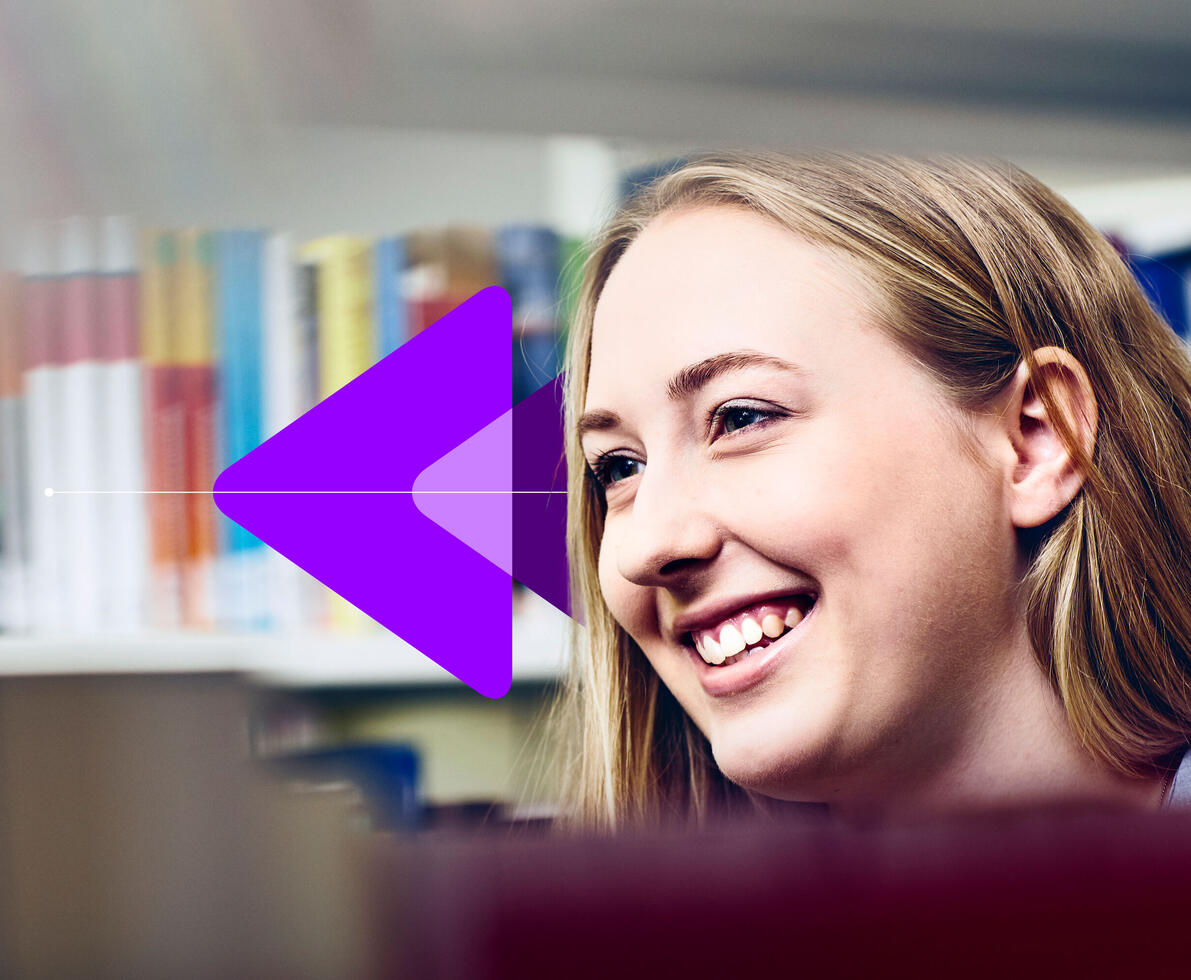 A smiling young woman with long blonde hair looks towards the side of the frame, with bookshelves blurred in the background. A large, purple arrow pointing left partially overlays the image on the left side.
