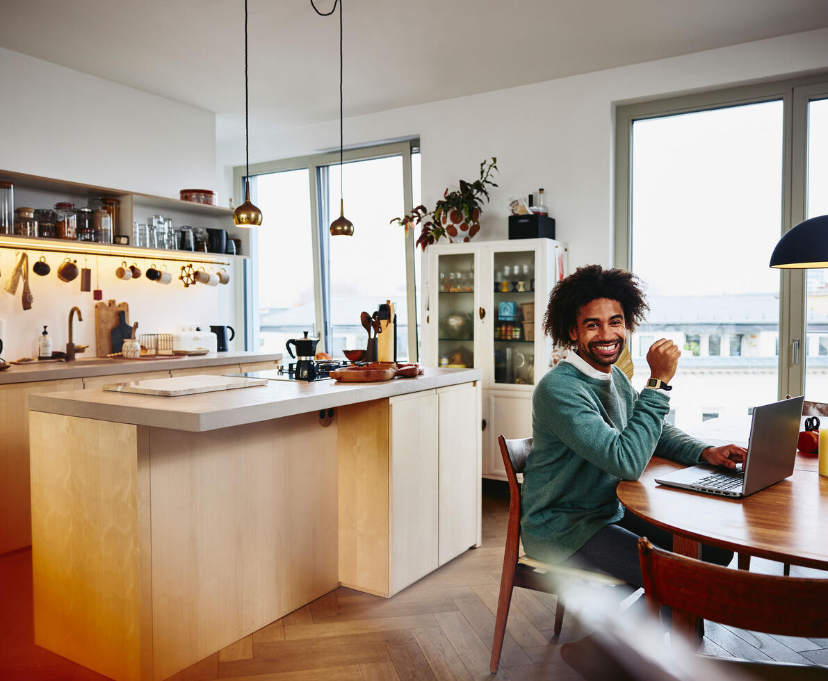 foster carer smiling at home working