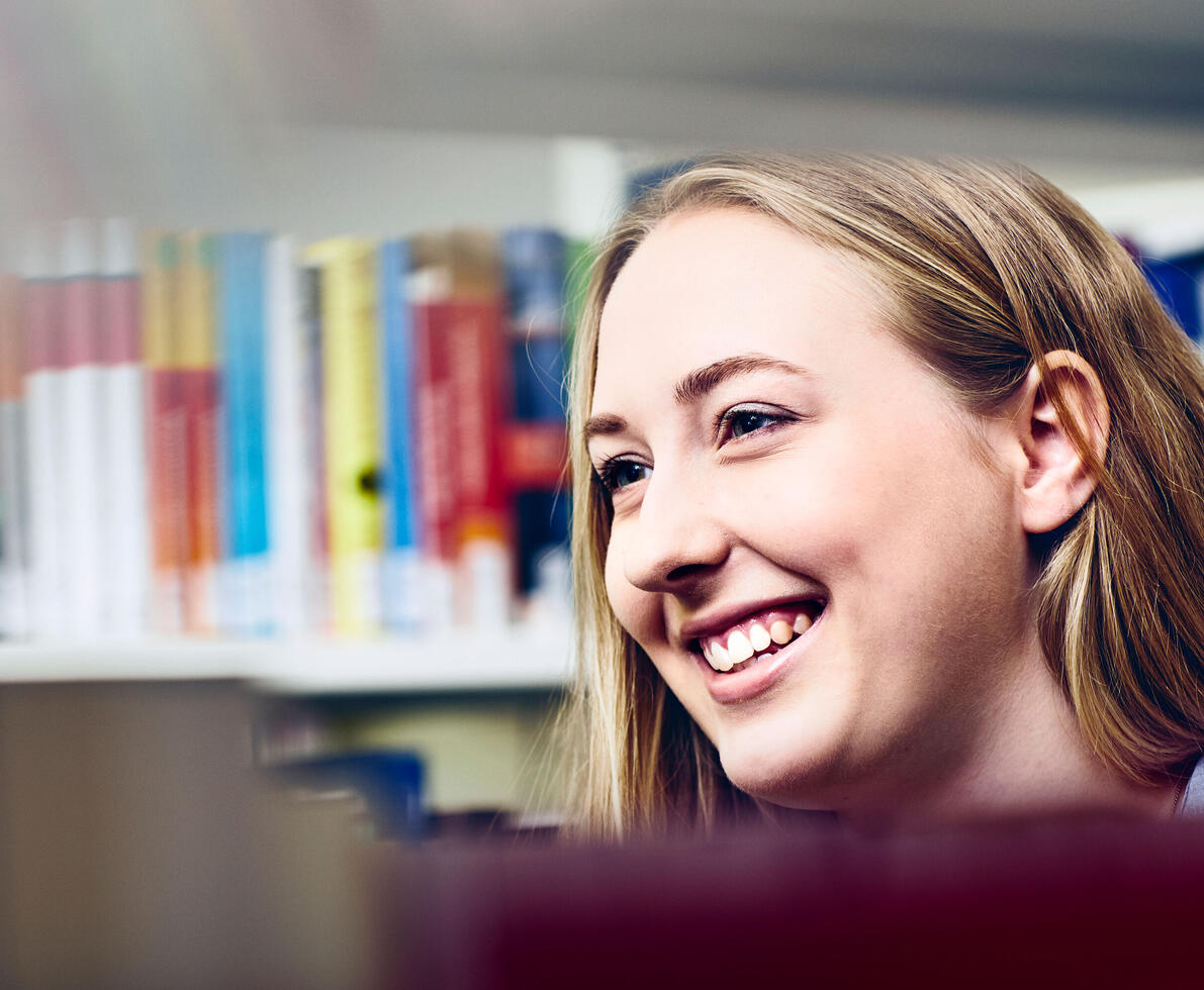 student smiling at university