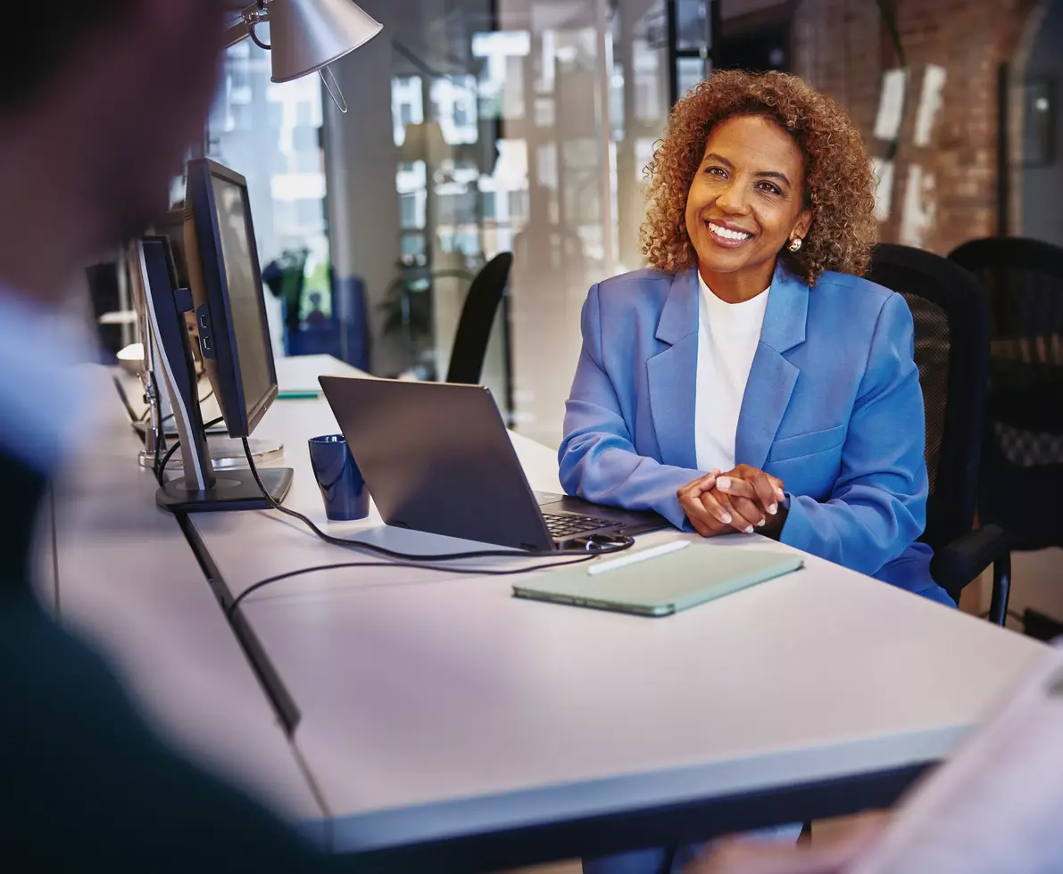 A lady is sitting in the office
