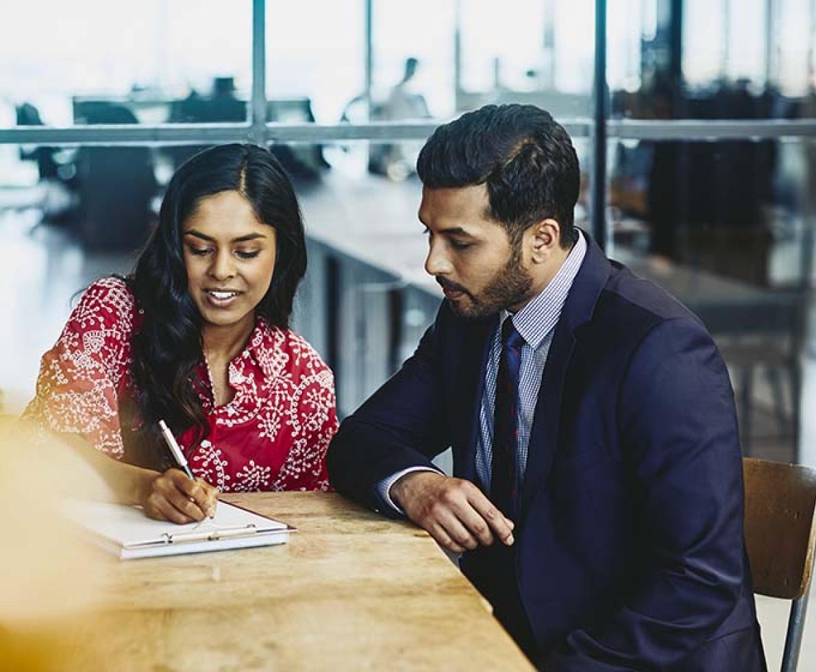 man and woman at desk