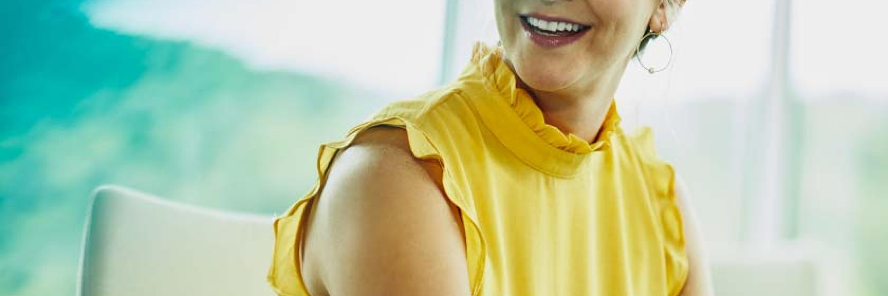 lady in yellow top smiling