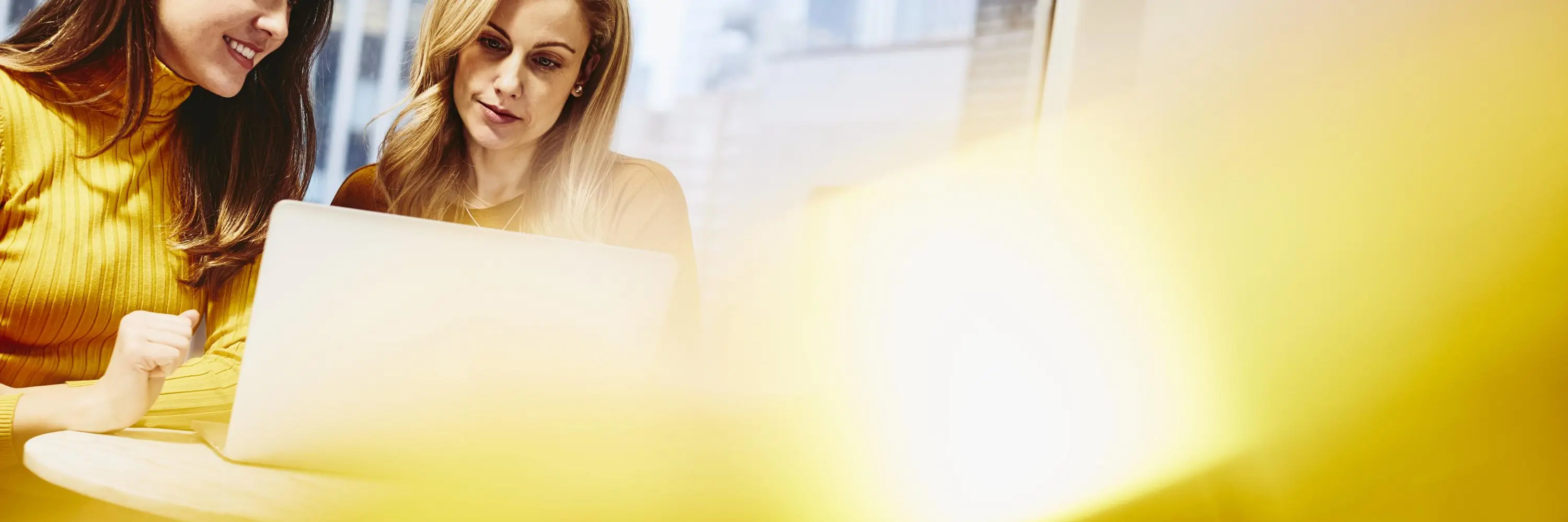 Two women working together