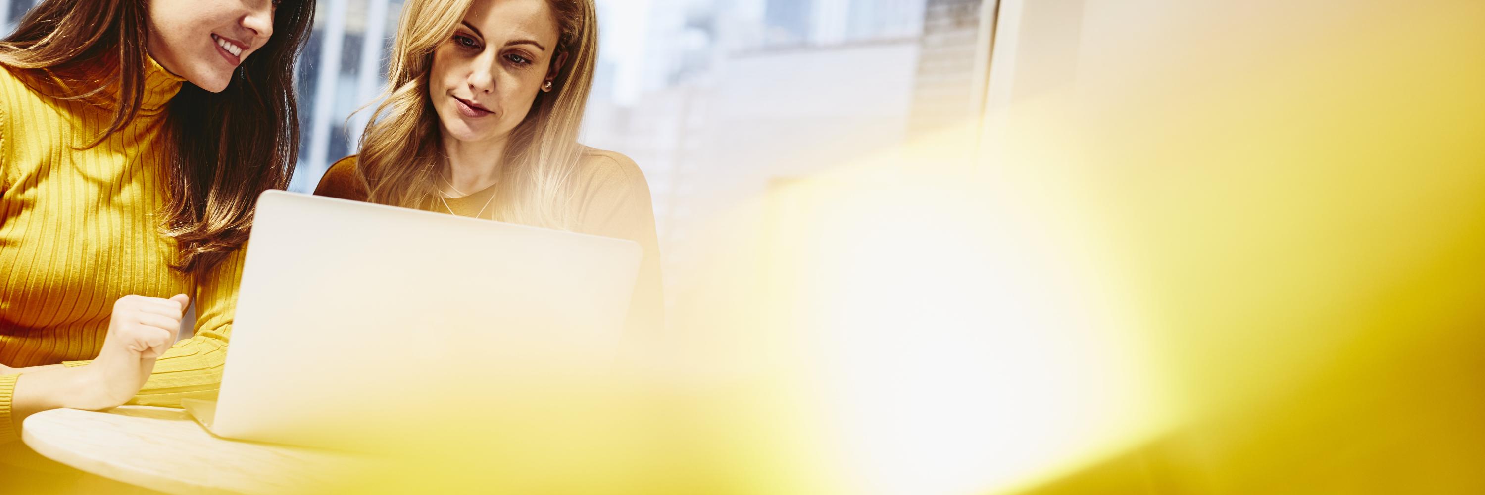 Two women working together