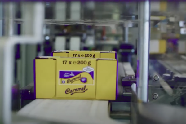 cadbury dairy milk bars on conveyor belt