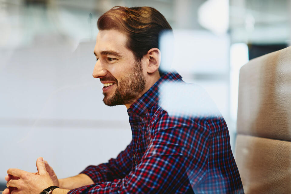 man smiling in office