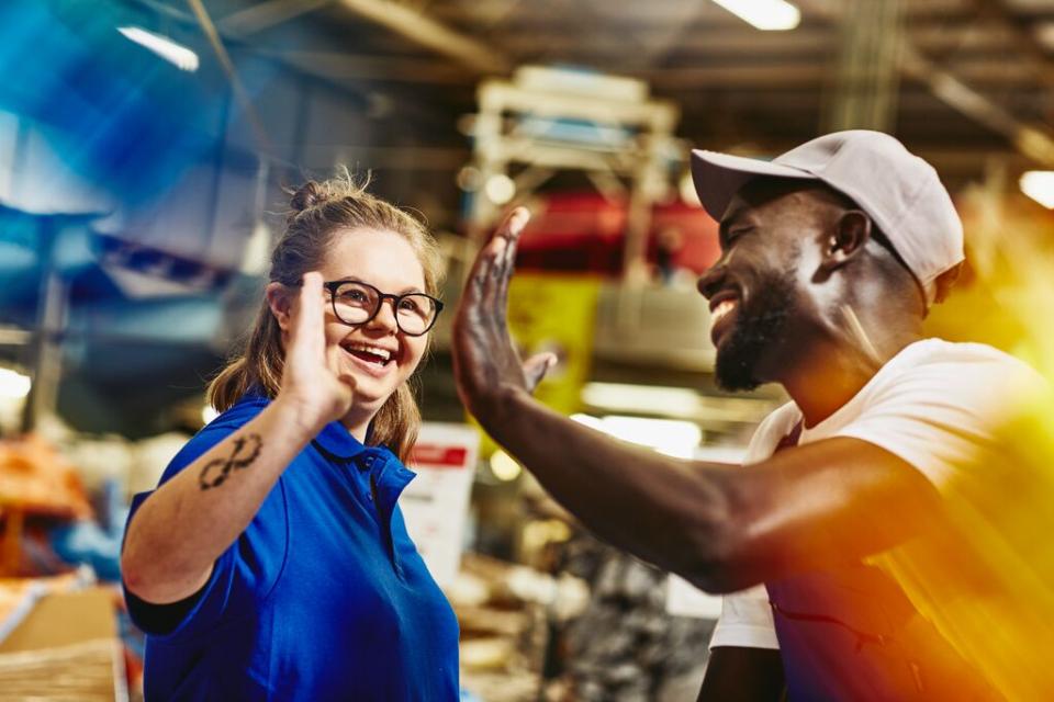 Image of man and woman giving a high five